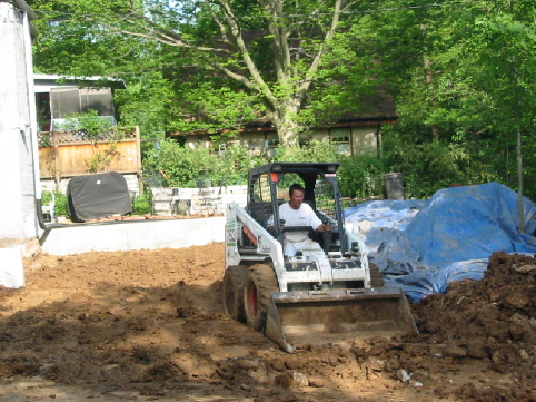 House Addition 2003 May 6 smoothing the mud with the bobcat.jpg